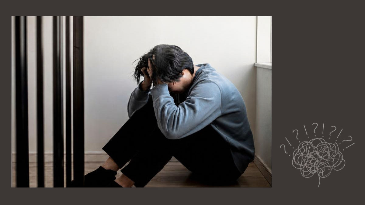 介護の悩みを抱え一人でうずくまる男性